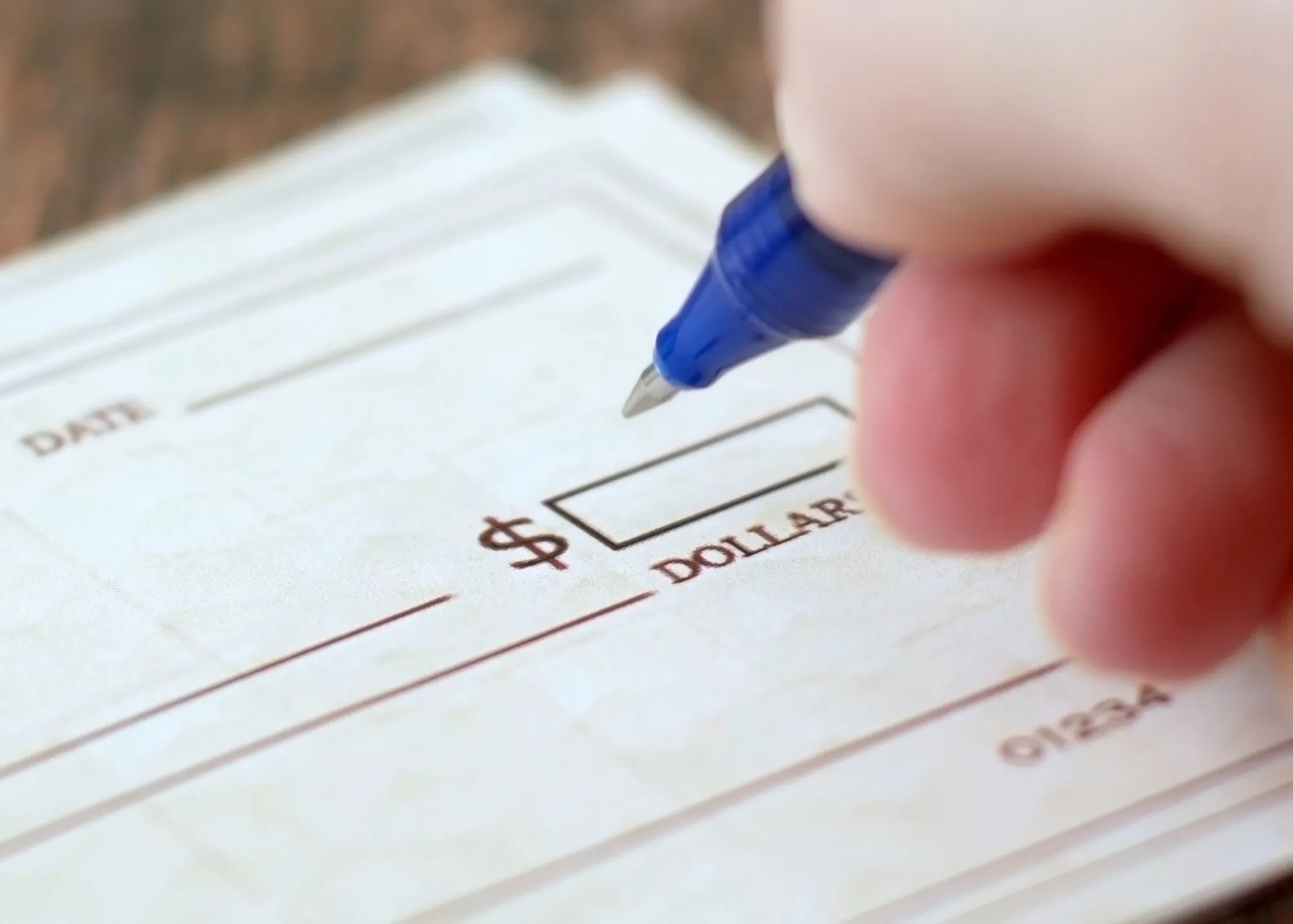 A person writing a check