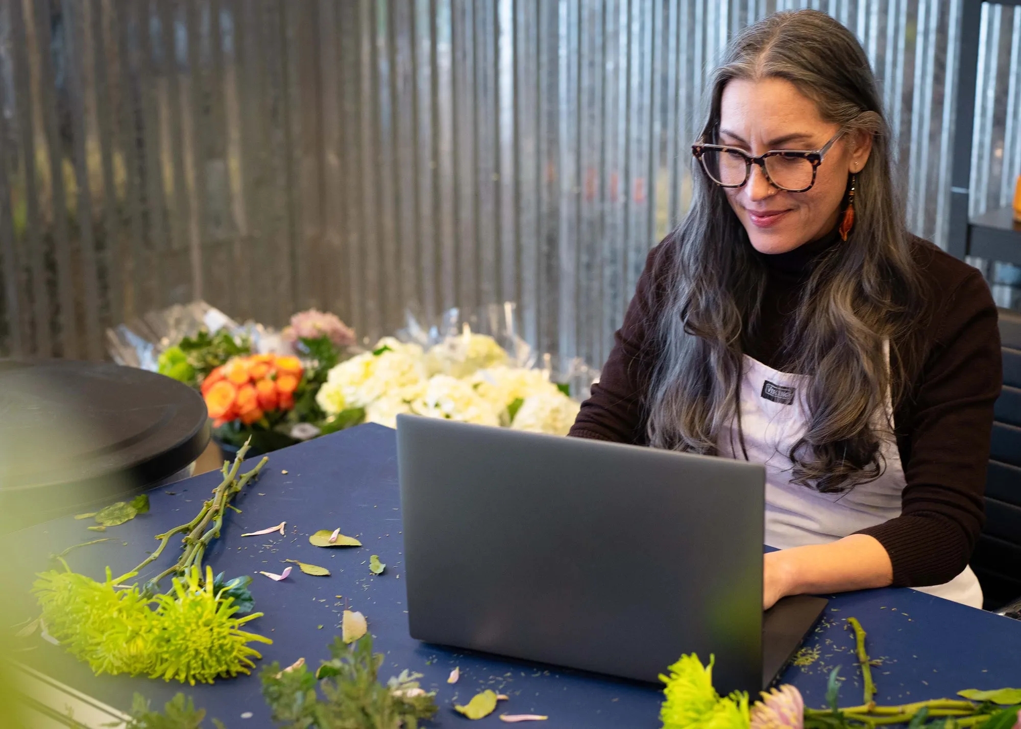 Woman typing on a laptop