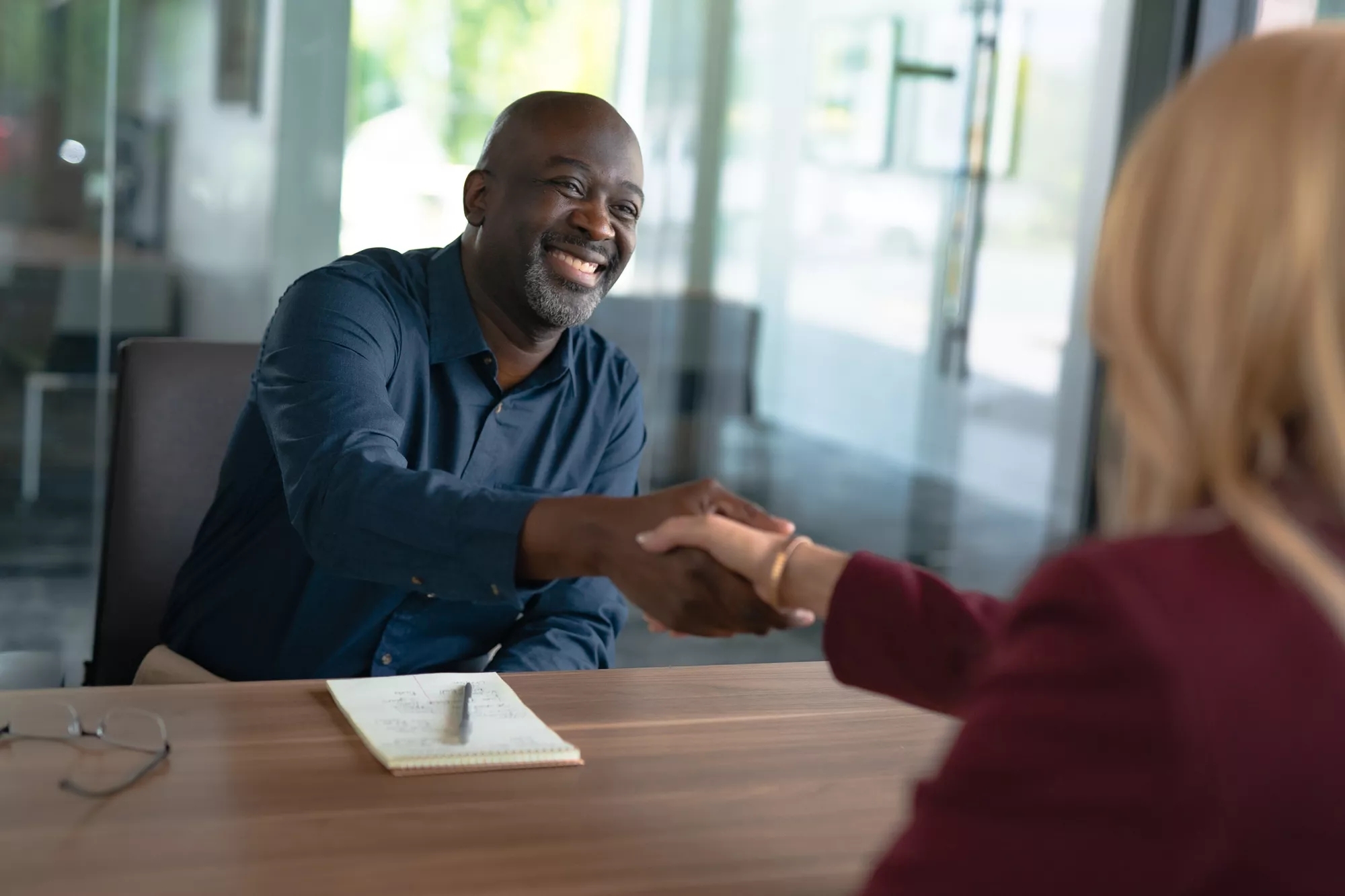Man and woman shaking hands