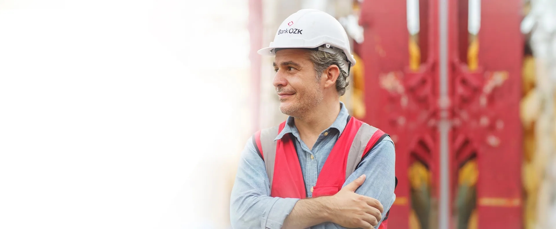 Man wearing a hard hat in a warehouse.