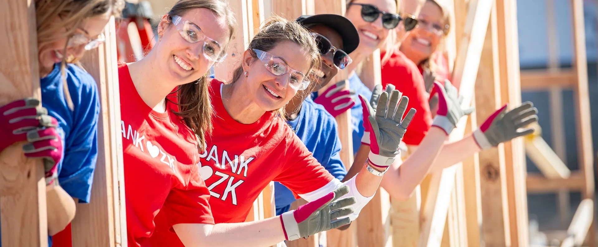 Bank OZK employees building a house